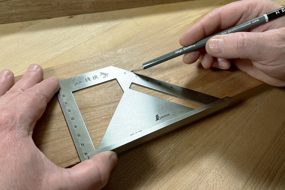 https://cdn11.bigcommerce.com/s-vao5inanlp/images/stencil/original/products/7058/13709/shinwa-stainless-steel-mitre-square-45-90-in-use__05865.1749640566.jpg?c=1